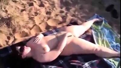 Mom Jenny masturbaties on a public beach on pornmilftube.net